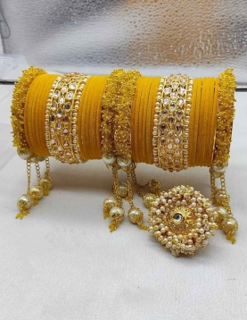 Gold Rodium Polish Yellow Bangles in Metal Alloy with Kundan