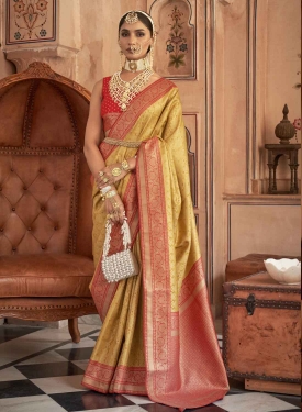 Apricot Orange Banarasi Silk Saree woven with pure banrasi silk threads along with excellent zari work